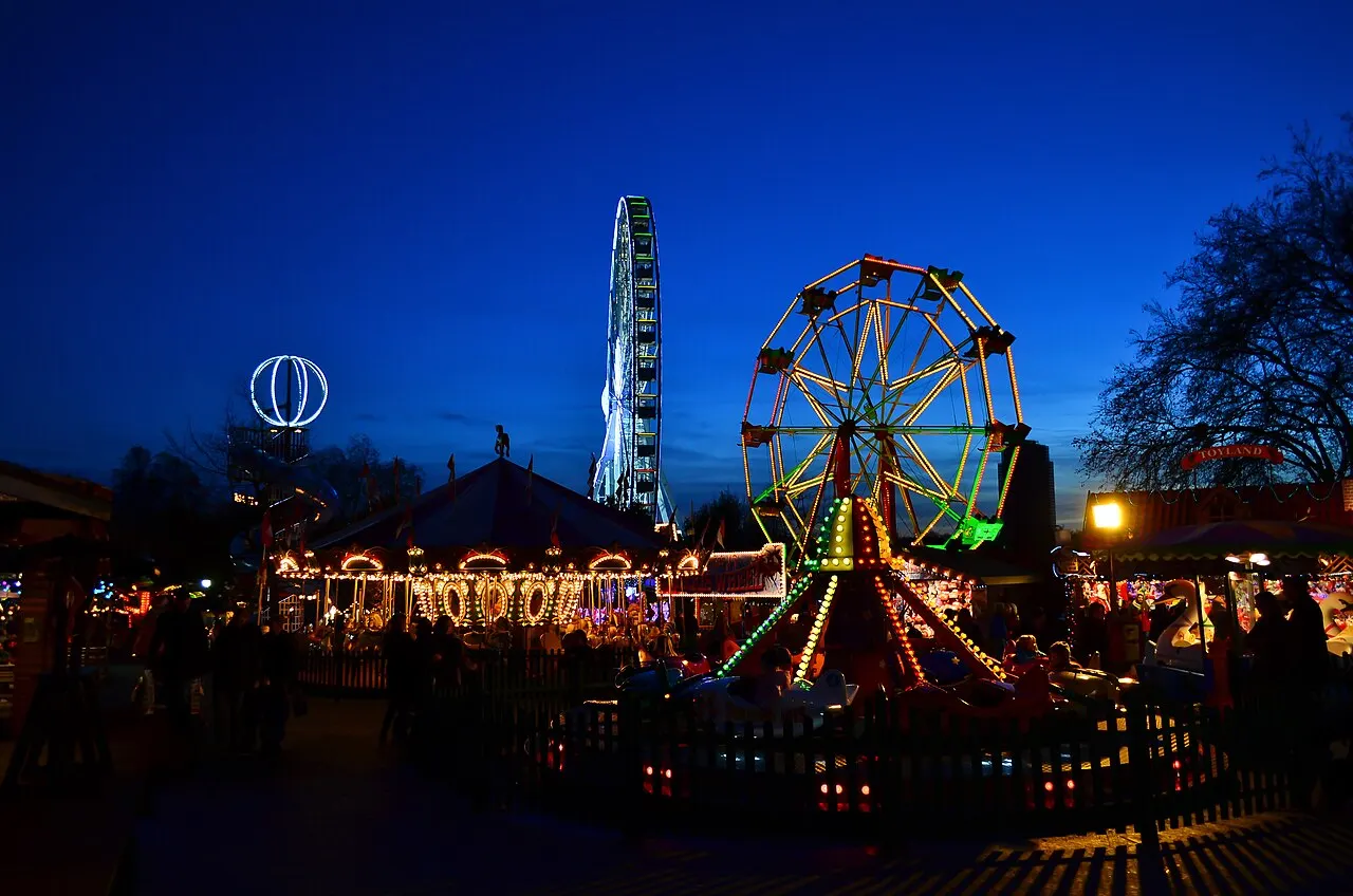 Rides and a big wheel lit up at Hyde Park Winter Wonderland, London