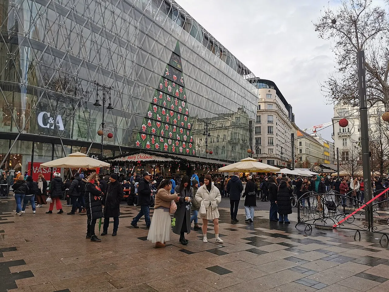 Visitors at the Christmas fair on Vörösmarty Square, Budapest