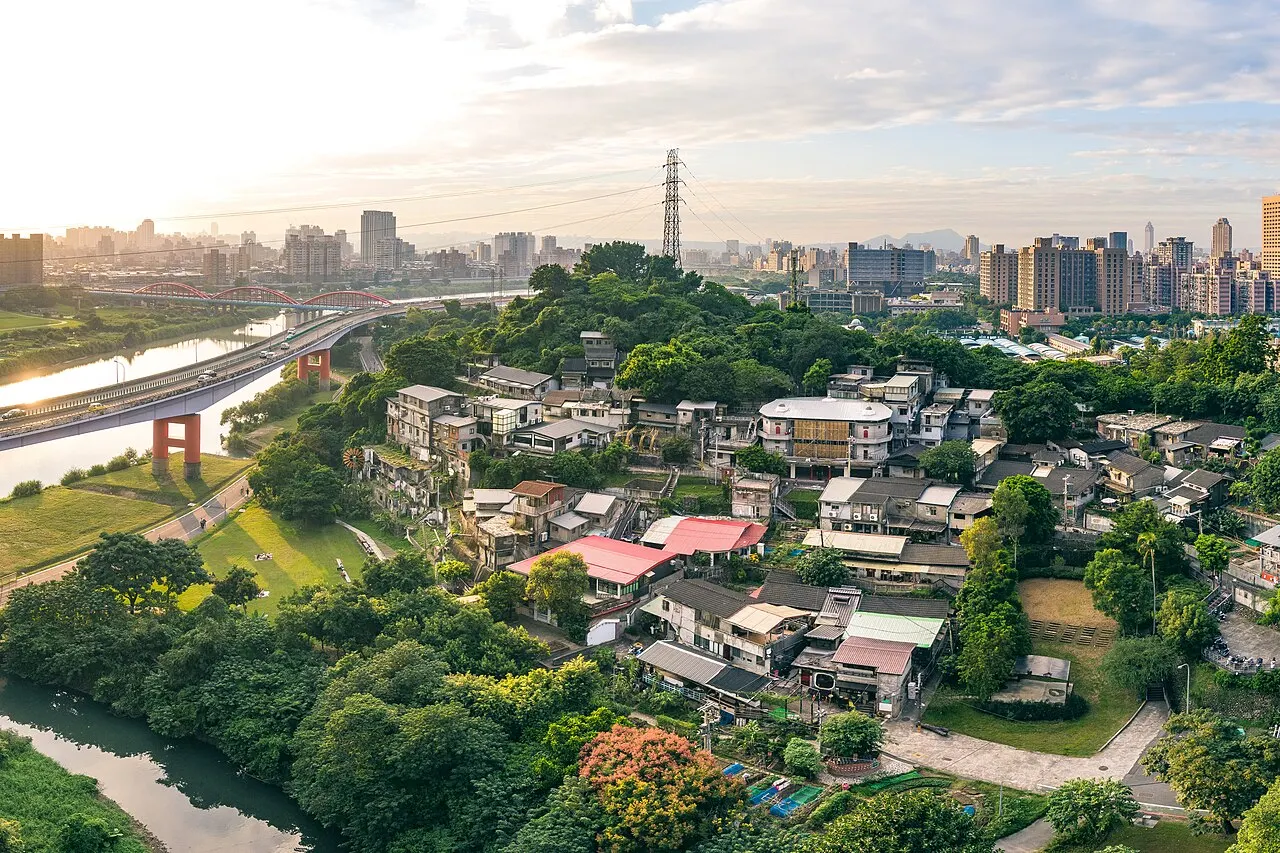 Treasure Hill's hillside houses above the Xindian River, with Taipei beyond