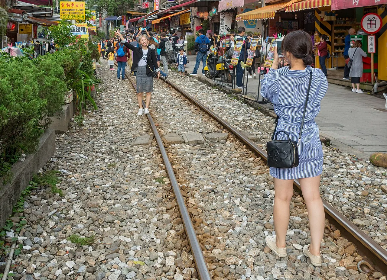 Visitors on the railway track at Shifen Old Street