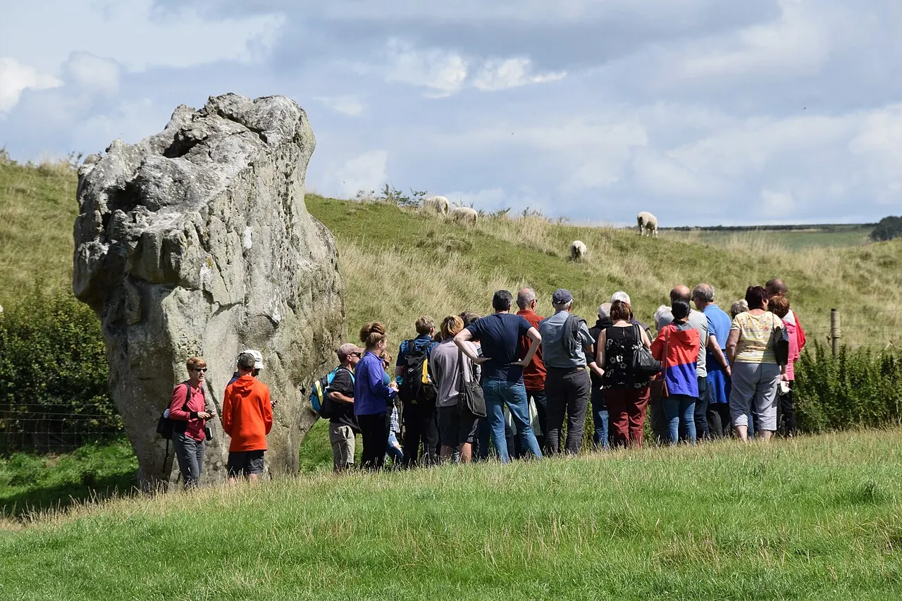 A guide explaining a heritage site to a tour group
