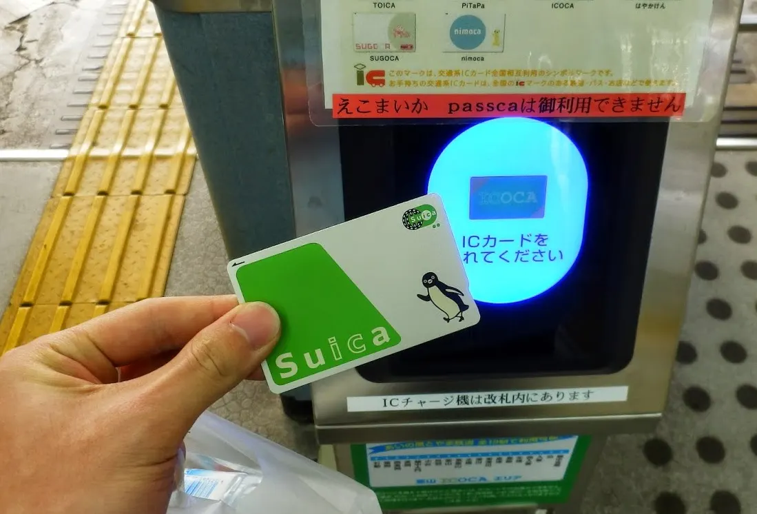 Tapping a Suica IC card at a ticket gate