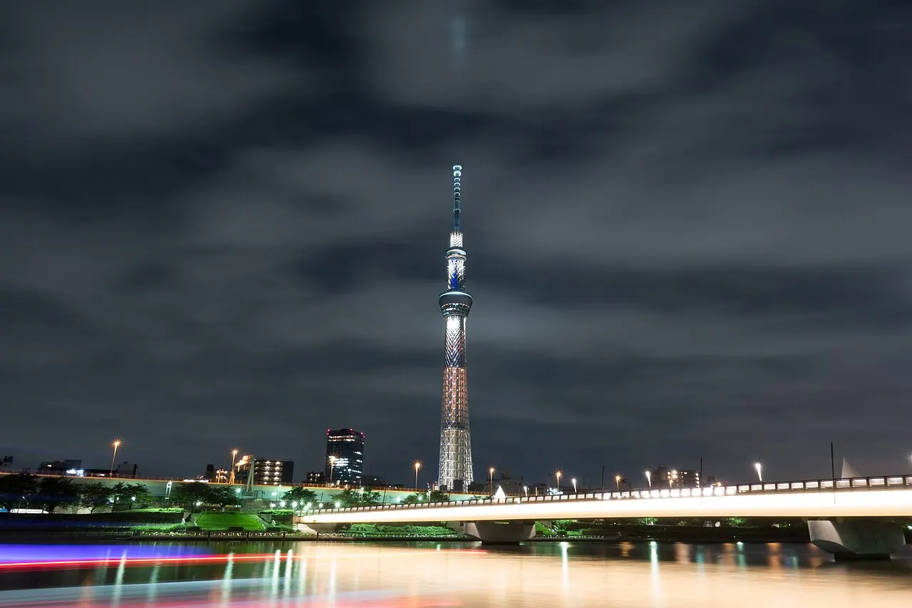 Tokyo Skytree lit up at night across the Sumida River